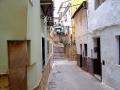 By going over the Pedralba streets
