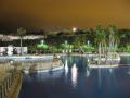 Swimming pool of Aqua Natura at night in Benidorm